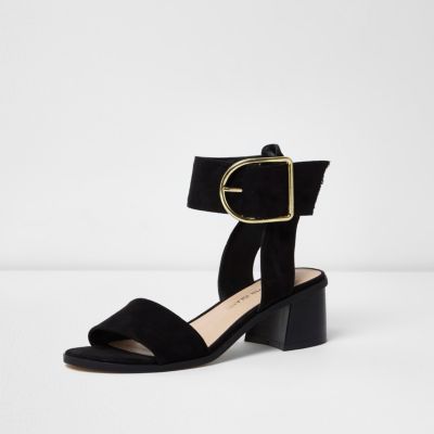 Black oversized buckle leather sandals